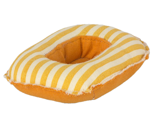 Yellow and white striped dog toy on a white background