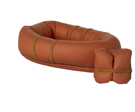 Brown inflatable life buoy with a smaller brown cushion on a white background