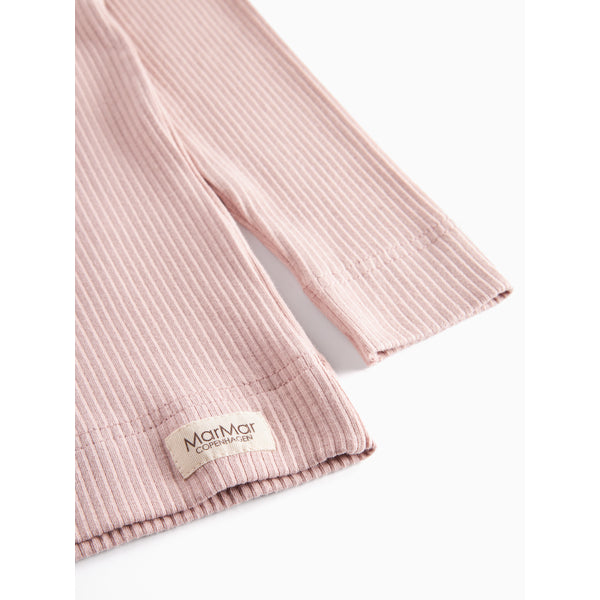 Pink ribbed fabric with a brand label on a white background