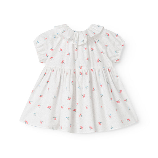 White dress with floral pattern on a white background