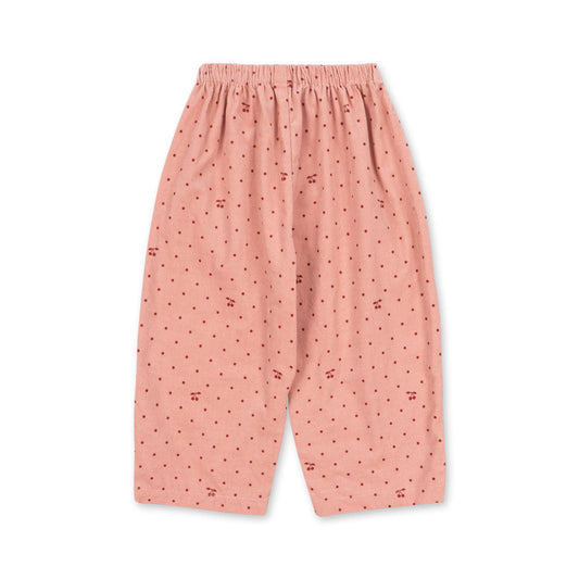 Pink pajama pants with a subtle pattern on a white background