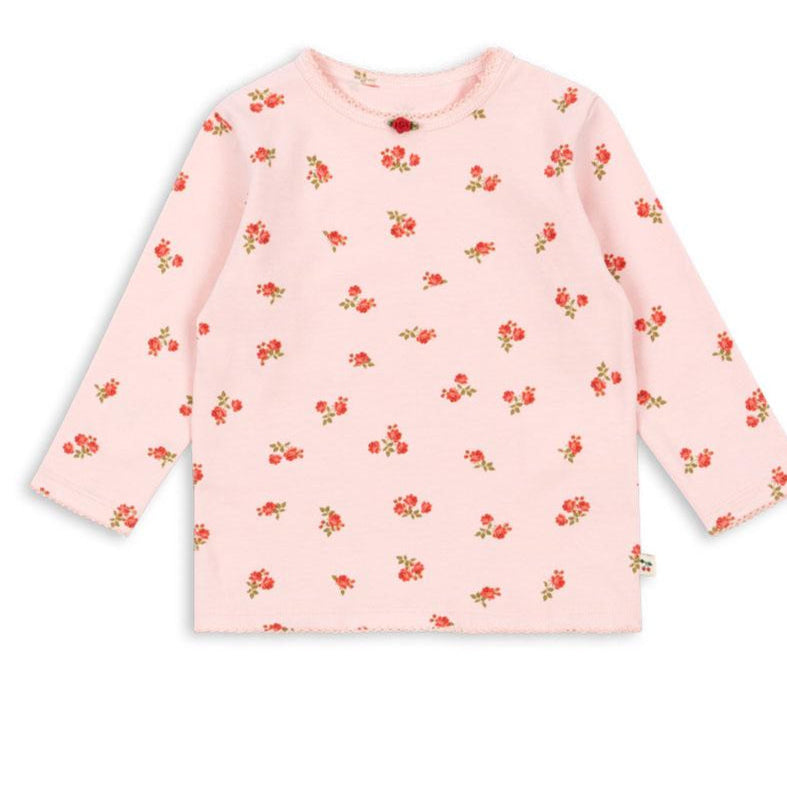 Pink long-sleeve shirt with red floral pattern on a white background