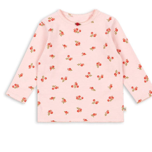 Pink long-sleeve shirt with red floral pattern on a white background