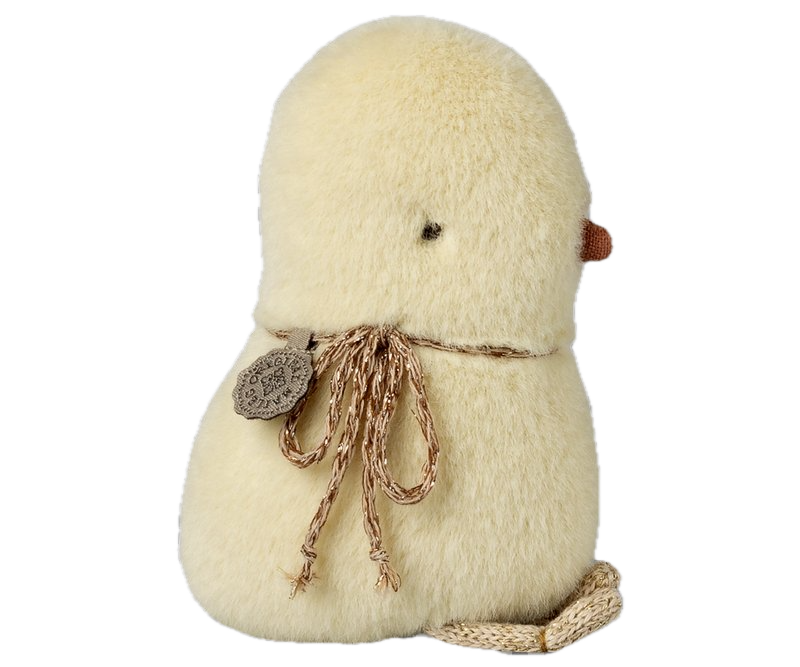 Small plush bird with a string bow on a white background