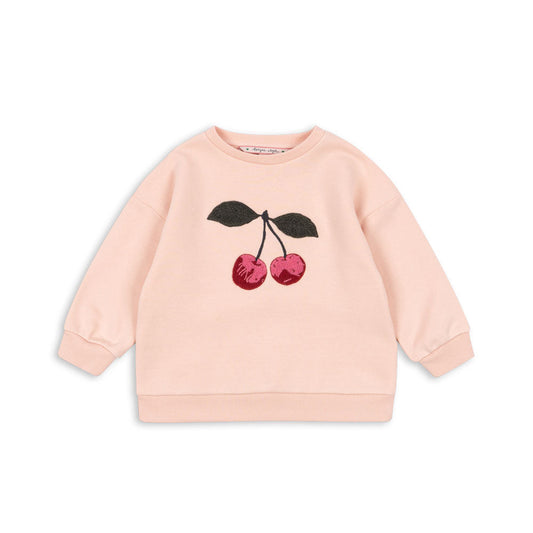 Pink sweatshirt with cherry design on a white background