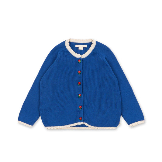 A royal blue knit cardigan sweater with white scalloped trim on the collar, cuffs, and hem, featuring decorative red and green buttons down the front, displayed on a clean white background.
