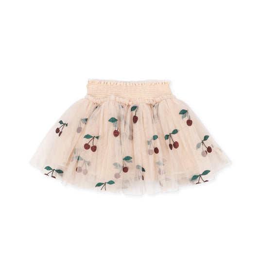 A light peach tulle tutu skirt with embroidered cherry motifs in red and green, displayed against a solid white background.