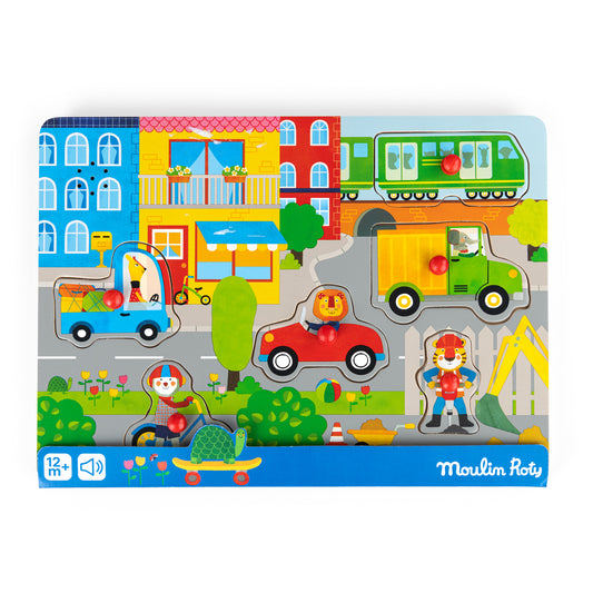 Children's puzzle with colorful vehicles and buildings, featuring the Moulin Roty brand.