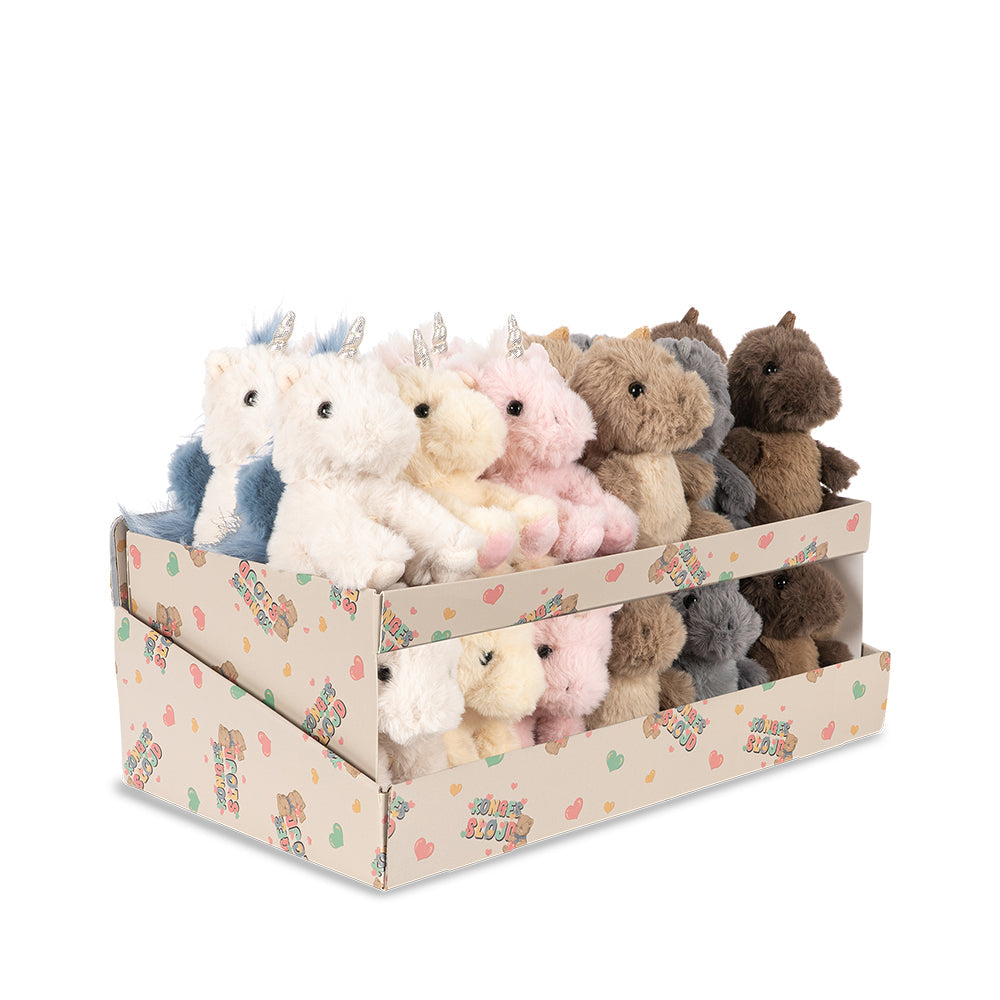 A retail display box filled with small plush stuffed animals, including white, pink, brown, gray, and blue unicorns and bears, on a plain white background.