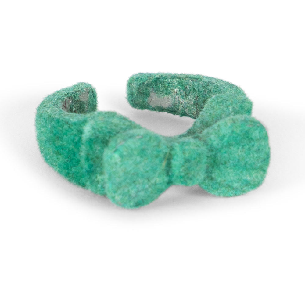 Green textured dog toy on a white background