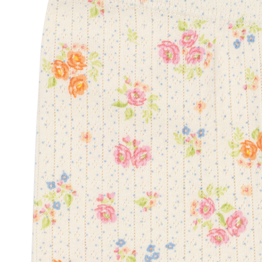 Floral patterned fabric with colorful flowers on a white background