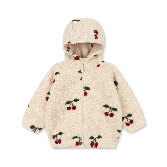 A cream-colored sherpa zip-up hoodie with an all-over cherry print, featuring red cherries with green leaves and a matching cherry detail on the hood, shown against a plain white background.