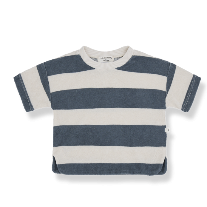 A short-sleeved children's T-shirt featuring bold, horizontal navy blue and off-white stripes. The shirt has a relaxed fit with a round neckline and slightly curved hem. The fabric appears soft and plush, making it comfortable for everyday wear.