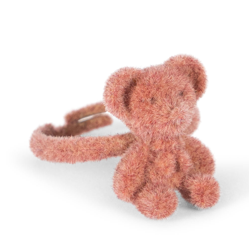 Fluffy pink teddy bear-shaped hair tie on a white background Konges slojd