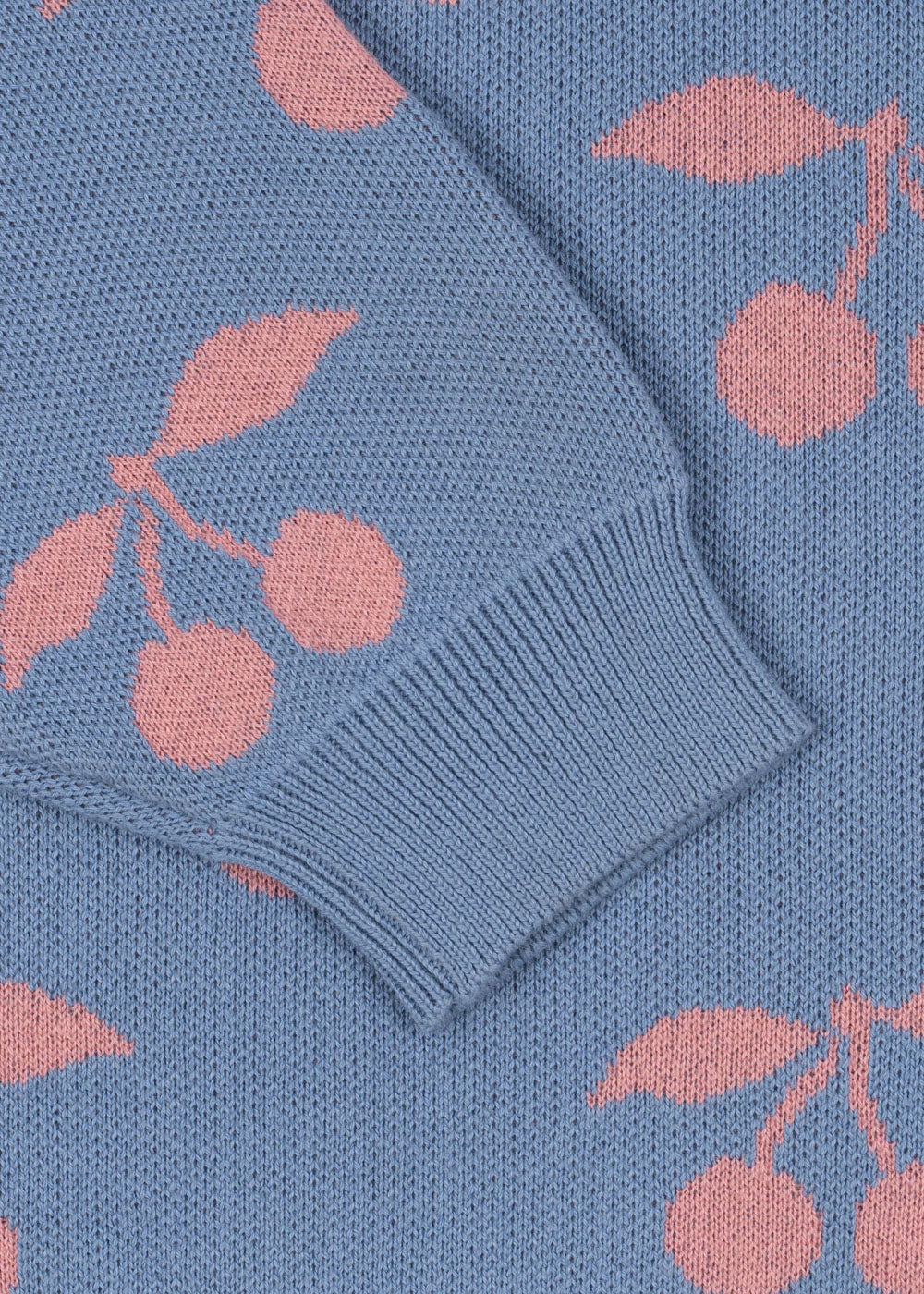 Blue knitted sweater with pink cherry pattern