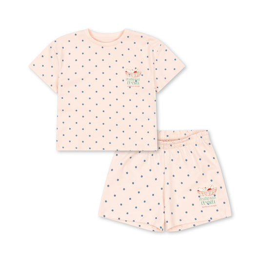Pink pajama set with small patterns on a white background
