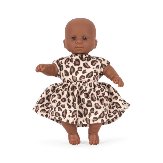 Doll wearing a leopard print dress on a white background