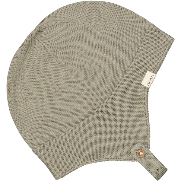 A sage green baby boys hat, from Sonny Bear to keep baby head warm..By Marmar Copenhagen