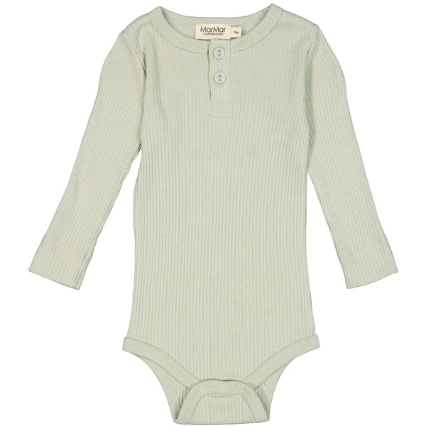Sage green long sleeves with two buttons on the neck. Snap button on the crotch for easy changing. Made from organic cotton.48% Organic Cotton 47% TENCEL™ Modal 5% Elastane