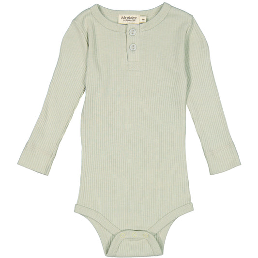 Sage green long sleeves with two buttons on the neck. Snap button on the crotch for easy changing. Made from organic cotton.48% Organic Cotton 47% TENCEL™ Modal 5% Elastane