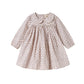 Children's dress with floral pattern on a white background