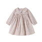 Children's dress with floral pattern on a white background