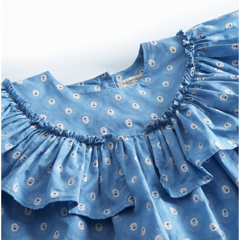 Blue dress with floral pattern on a white background