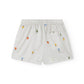 White shorts with colorful embroidered designs on a white background