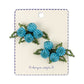 Pair of blue beaded earrings on a branded card against a white background from Konges Slojd