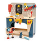 Wooden toy workbench with tools and accessories on a white background