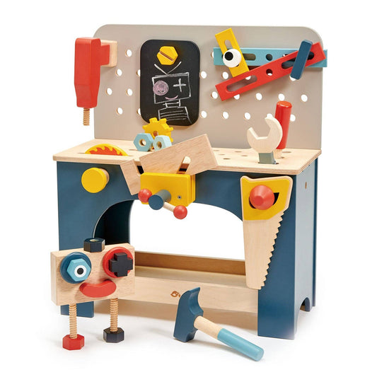 Wooden toy workbench with tools and accessories on a white background