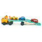 Wooden toy truck with a flatbed carrying three cars on a white background