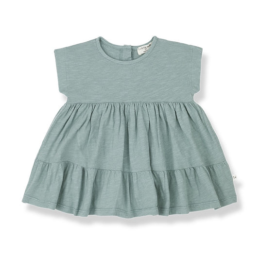 A light cotton siummer dress with short sleeves and ruffles on the skirt.Made from orgaic cotton.