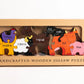 Box of handcrafted wooden jigsaw puzzles with animal illustrations on a white background