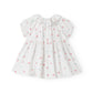 White dress with floral pattern on a white background