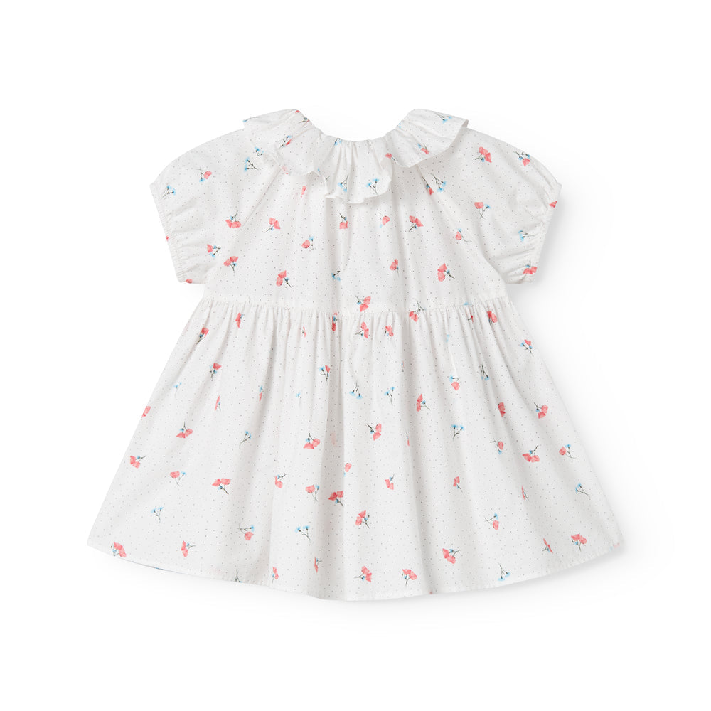 White dress with floral pattern on a white background
