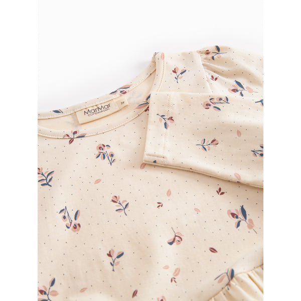 Floral patterned fabric with a brand label on a white background