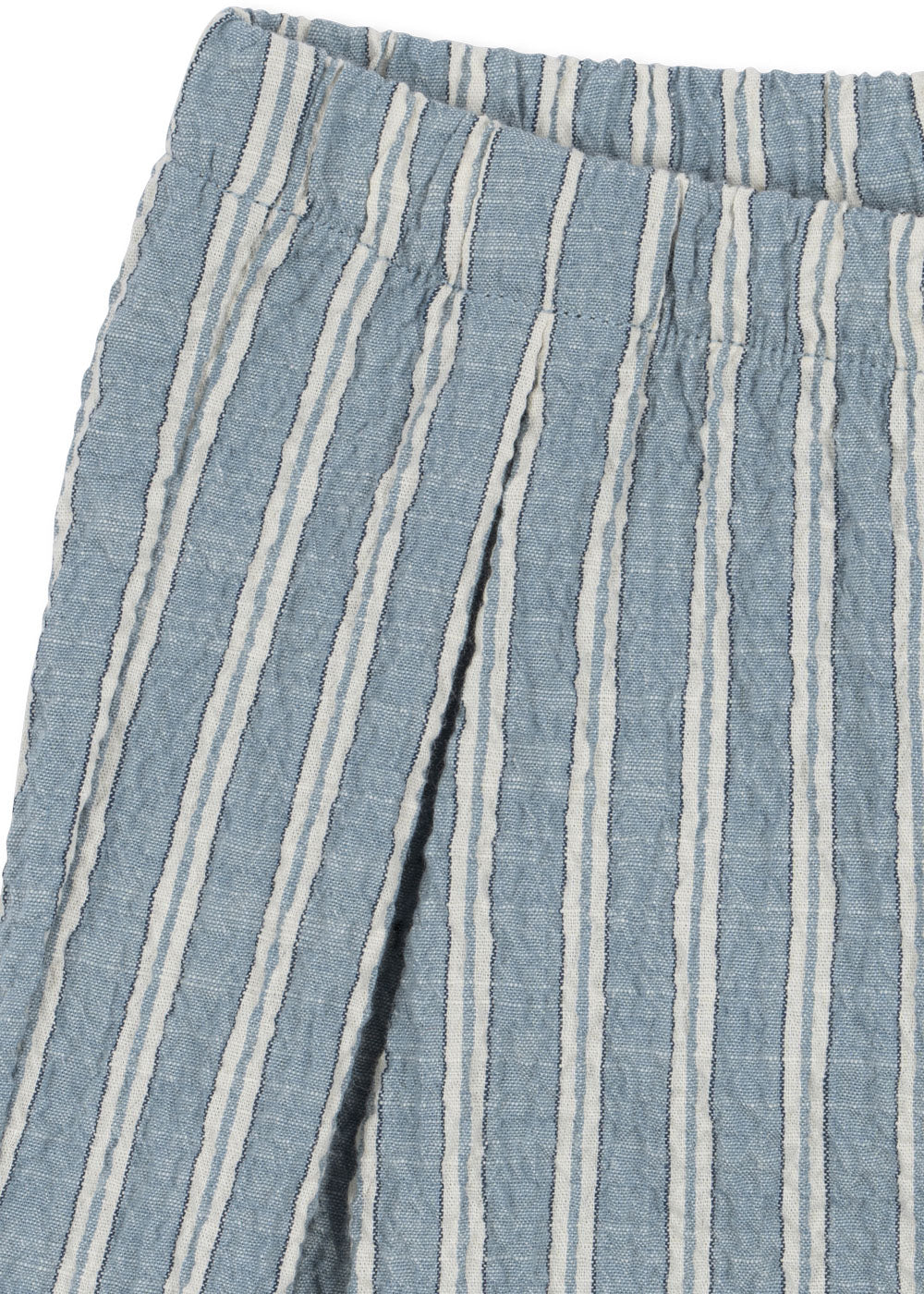 Close-up of blue and white striped organic cotton fabric with a textured pattern.