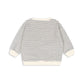 A long-sleeve knit top with thin horizontal gray stripes on an off-white base, featuring solid off-white ribbed cuffs, hem, and collar, shown from the back on a white background.