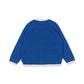 A royal blue knit sweater shown from the back, featuring cream-colored ribbed trim along the collar, cuffs, and hem.