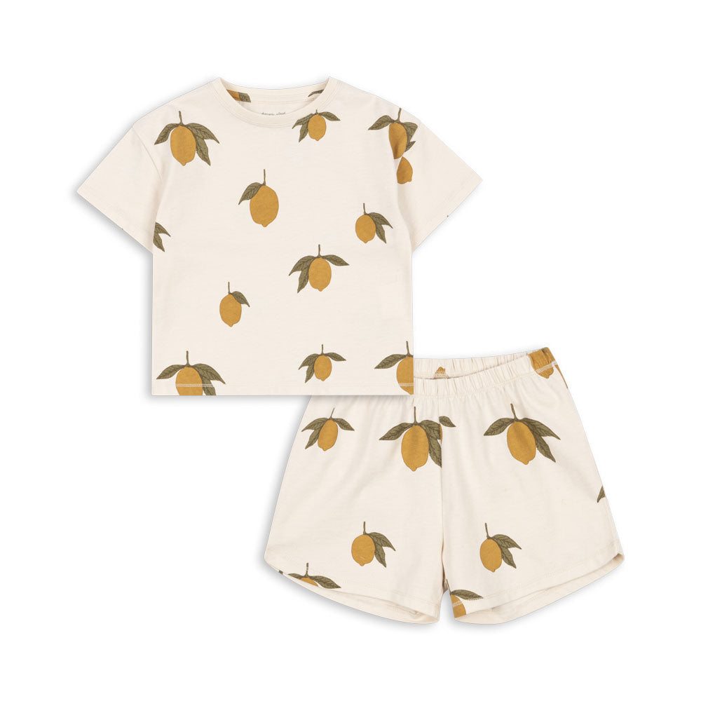 Children's   organic cotton outfit with t-shirt and shorts featuring lemon pattern on a white background