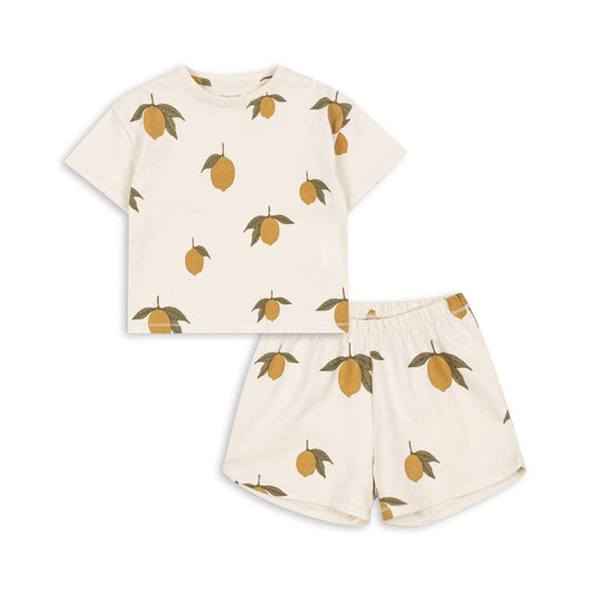 Children's   organic cotton outfit with t-shirt and shorts featuring lemon pattern on a white background