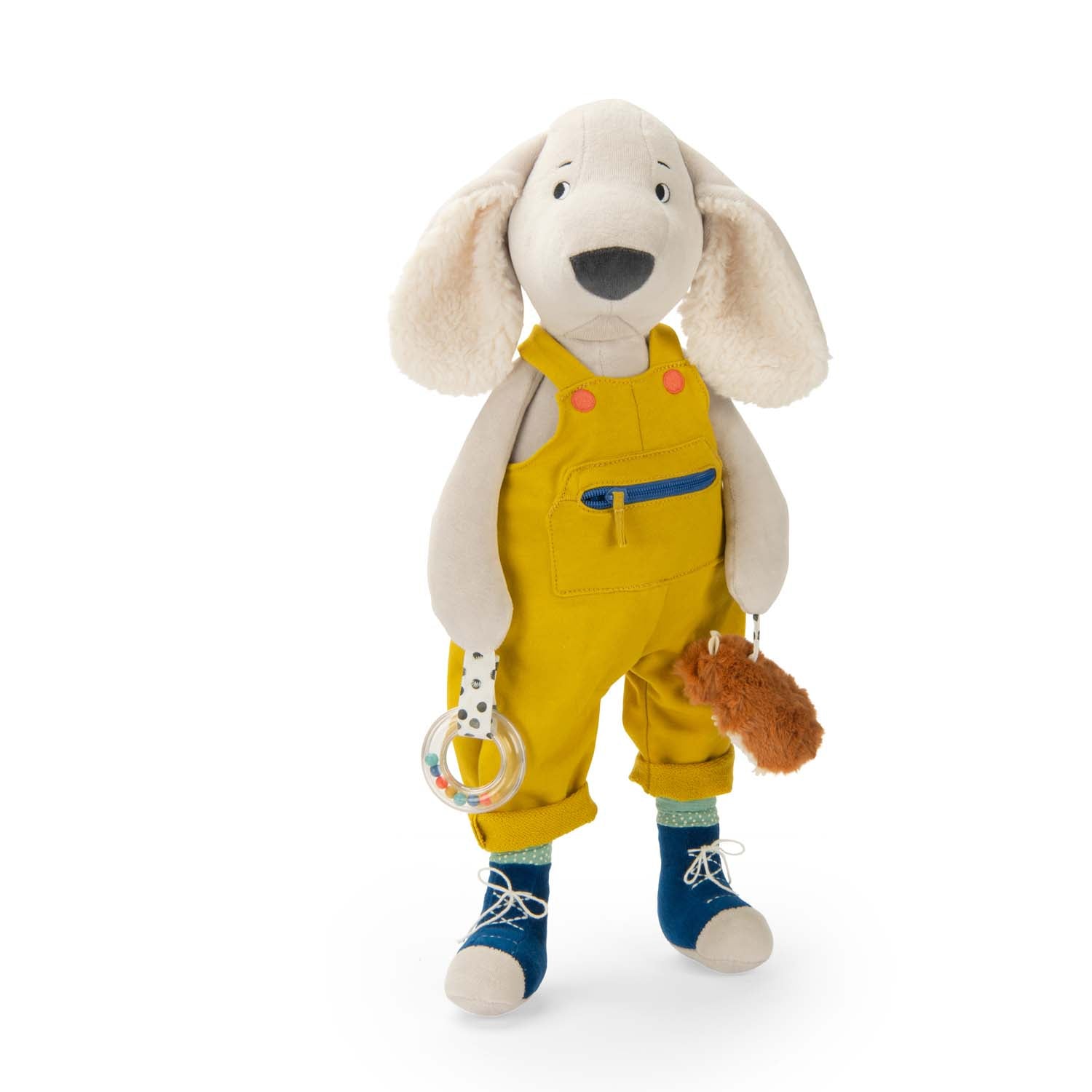 Stuffed dog toy in yellow overalls with a pacifier and rattle on a white background