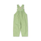A light green baby overall jumpsuit with a white polka dot pattern, featuring adjustable shoulder straps and a smocked chest, shown flat on a white background.