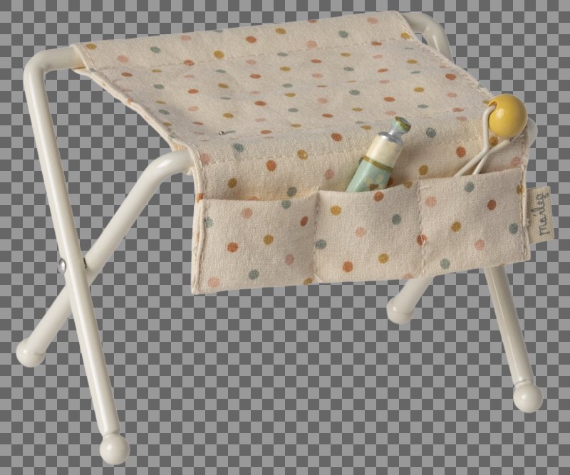Small white stool with a polka dot cushion and toys on a transparent background