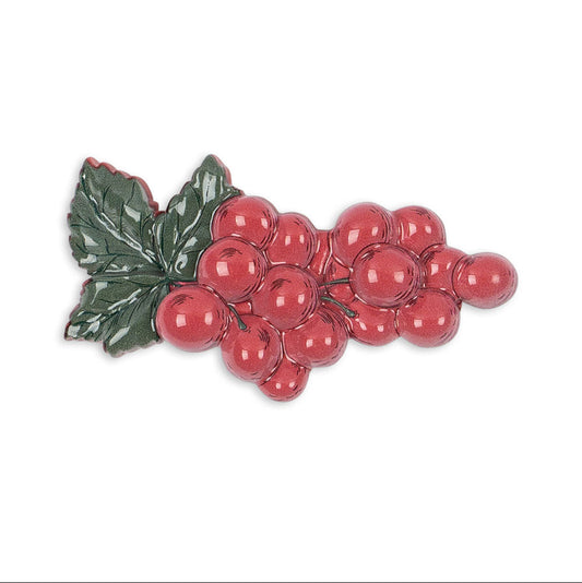Decorative plate with red berries and green leaves on a white background
