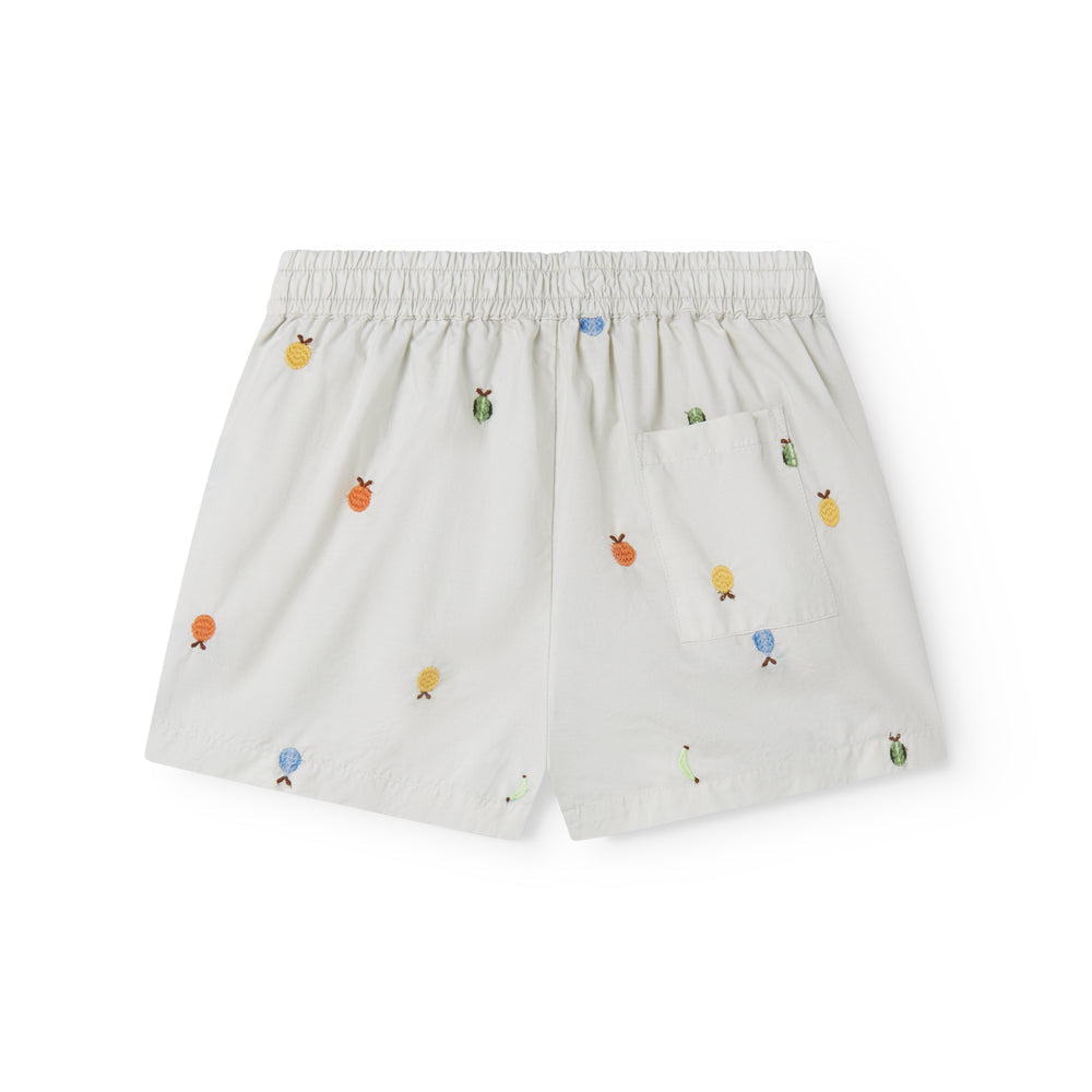 White shorts with colorful embroidered designs on a white background