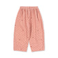 Pink pajama pants with a subtle pattern on a white background