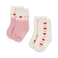 Two pairs of socks with heart patterns on a white background. Knoges Slojd