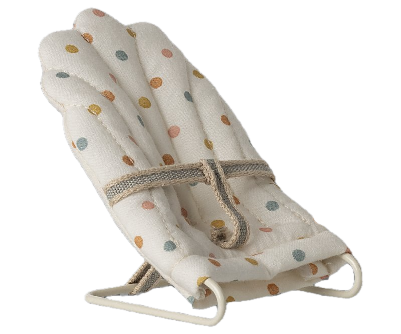 Baby bouncer with colorful polka dot pattern on a white background